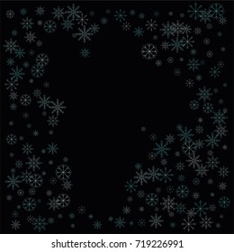 Christmas snow spray frame or border of a random scatter snowflakes isolated on black. Snow explosion. Ice storm.