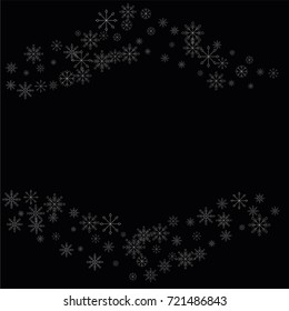 Christmas snow spray frame or border of a random scatter snowflakes isolated on black. Snow explosion. Ice storm.