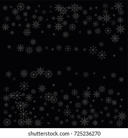 Christmas snow spray frame or border of a random scatter snowflakes isolated on black. Snow explosion. Ice storm.