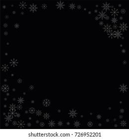Christmas snow spray frame or border of a random scatter snowflakes isolated on black. Snow explosion. Ice storm.