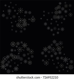 Christmas snow spray frame or border of a random scatter snowflakes isolated on black. Snow explosion. Ice storm.