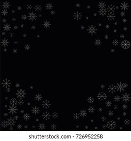 Christmas snow spray frame or border of a random scatter snowflakes isolated on black. Snow explosion. Ice storm.