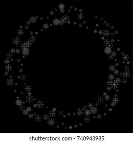 Christmas snow spray frame or border of a random scatter snowflakes isolated on black. Snow explosion. Ice storm.