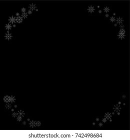 Christmas snow spray frame or border of a random scatter snowflakes isolated on black. Snow explosion. Ice storm.