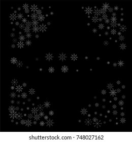 Christmas snow spray frame or border of a random scatter snowflakes isolated on black. Snow explosion. Ice storm.