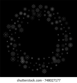 Christmas snow spray frame or border of a random scatter snowflakes isolated on black. Snow explosion. Ice storm.