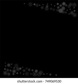 Christmas snow spray frame or border of a random scatter snowflakes isolated on black. Snow explosion. Ice storm.