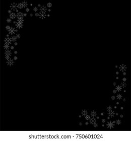 Christmas snow spray frame or border of a random scatter snowflakes isolated on black. Snow explosion. Ice storm.