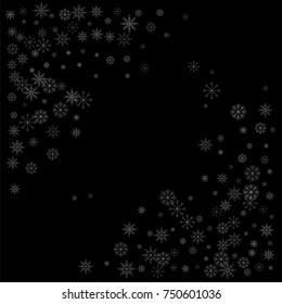 Christmas snow spray frame or border of a random scatter snowflakes isolated on black. Snow explosion. Ice storm.