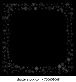 Christmas snow spray frame or border of a random scatter snowflakes isolated on black. Snow explosion. Ice storm.