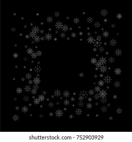 Christmas snow spray frame or border of a random scatter snowflakes isolated on black. Snow explosion. Ice storm.