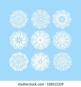  christmas snowflake decoration set isolated on blue, circle lace round ornamental geometric winter pattern collection, vector illustration
