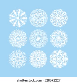  christmas snowflake decoration set isolated on blue, circle lace round ornamental geometric winter pattern collection, vector illustration