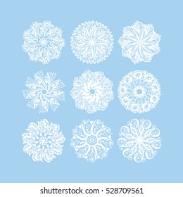  christmas snowflake decoration set isolated on blue, circle lace round ornamental geometric winter pattern collection, vector illustration