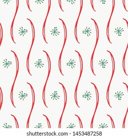 Christmas snowflake doodle seamless pattern in red, green and white. Stylized tiled design, great for winter holiday decorating, gift wrapping paper, textiles, paper items, greeting cards and decor.