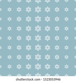 Christmas snowflake pattern in halftone style. White snowflakes on blue background. Vector illustration