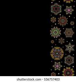 Christmas snowflakes in brown, red and pink colors with doodles and dots on black background. Winter boarder. Vertical floral border. Vector pattern, seamless, Christmas background.