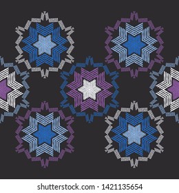 Christmas snowflakes. Ethnic boho seamless pattern. Lace. Embroidery on fabric. Patchwork texture. Weaving. Traditional ornament. Tribal pattern. Folk motif. Can be used for wallpaper, textile.