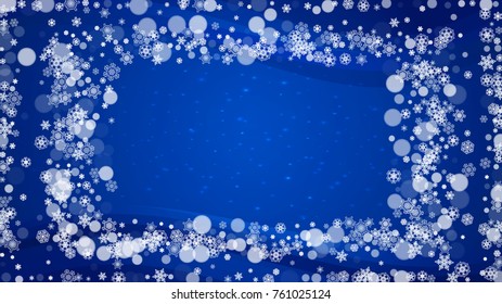 Christmas snowflakes on blue background with sparkles. Horizontal frame for winter banner, gift coupon, voucher, ads, party events with Christmas snowflakes. Falling snow for holiday celebration