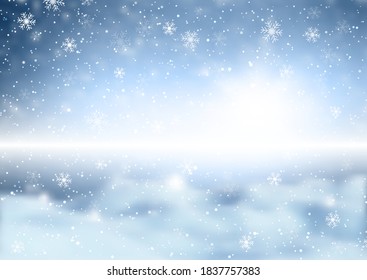 Christmas snowflakes on a defocussed winter landscape background