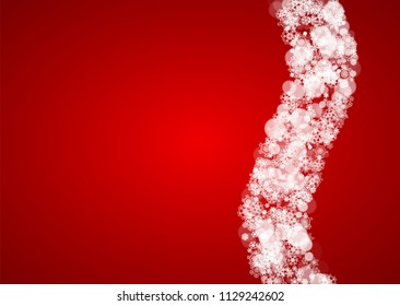 Christmas snowflakes on red background. Santa Claus colors. Horizontal frame for winter banner, gift coupon, voucher, ads, party events with Christmas snowflakes. Falling snow for holiday celebration