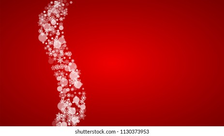 Christmas snowflakes on red background. Santa Claus colors. Horizontal Christmas snowflakes frame for holiday banners, cards, sales, special offers. Falling snow with bokeh for party celebration