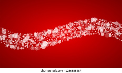Christmas snowflakes on red background. Santa Claus colors. Horizontal Christmas snowflakes frame for holiday banners, cards, sales, special offers. Falling snow with bokeh for party celebration