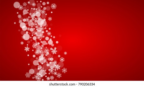 Christmas snowflakes on red background. Santa Claus colors. Horizontal Christmas snowflakes frame for holiday banners, cards, sales, special offers. Falling snow with bokeh for party celebration