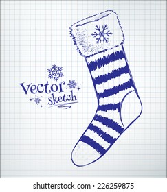 Christmas sock drawn on checkered paper. Vector illustration. isolated.