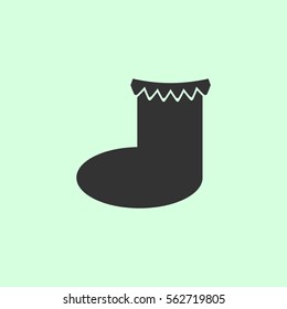 Christmas sock icon flat. Grey vector symbol on green background