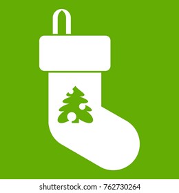 Christmas sock icon white isolated on green background. Vector illustration