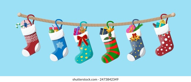 Christmas sock stocking on rope with holly, gift box, gingerbread man, glass ball candy cane. Happy new year decoration. Holiday new year and xmas celebration. Vector illustration flat style