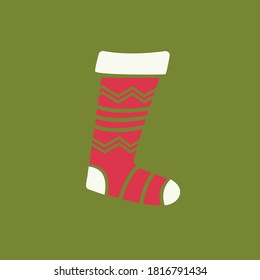 Christmas sock for sweets. Red sock for surprises on a green background.