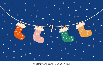 Christmas socks hanging on a string against a dark snowy night, warm holiday