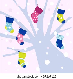 Christmas socks on winter tree, snowing behind - vector