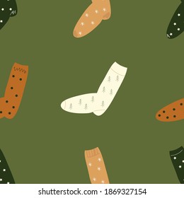 Christmas socks seamless pattern. Happy new year and Merry Christmas! Green and brown colors. Cozy and cute Christmas vector pattern. Warm winter socks vector 
