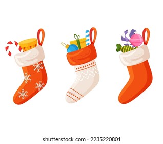 Christmas socks or stockings for Santa. Balls, gift box, sweets inside a socks on a white background. Xmas decorations for children. Vector flat illustration