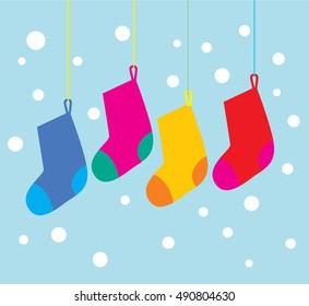 Christmas socks. vector illustration. Blank colorful christmas stockings hanging on the snowing background.