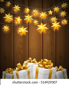 Christmas stars garland and gift boxes with gold ribbon on wood texture background. Vector illustration.
