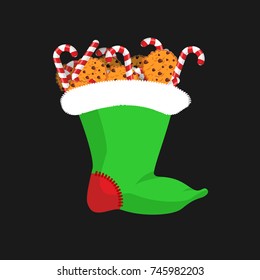 Christmas stocking with Candy cane and cookie. Christmas mint stick. traditional Holiday Xmas sock for gift