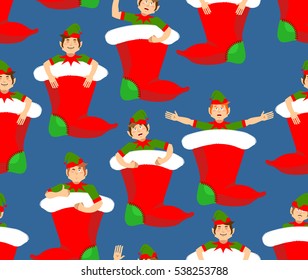 Christmas stocking and Santa Elf pattern. Little Claus helper ornament. traditional Holiday Xmas sock for gifts background
