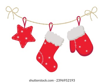 Christmas stockings with traditional holiday ornaments.Red Christmas mitten, Christmas toys. Hanging children clothing elements with cute xmas patterns on rope. Red socks with snowflakes.