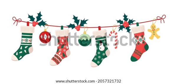 Christmas stockings with traditional holiday\
ornaments, decoration balls, gingerbread man. Hanging children\
clothing elements with xmas patterns on rope. Socks with\
snowflakes, snowman, christmas\
tree