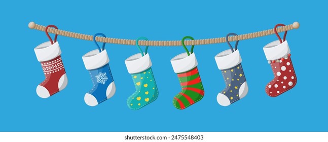 Christmas stockings in various colors on rope. Set of christmas cloth socks. Hanging holiday decorations for gifts. New year and xmas celebration. Vector illustration in flat style