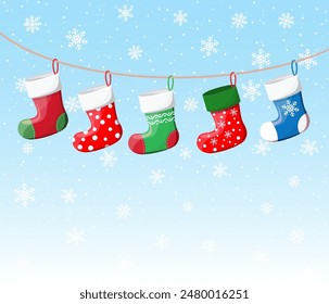 Christmas stockings in various colors on rope on snowflakes background. Set of christmas cloth socks. New year and xmas celebration. Vector illustration in flat style