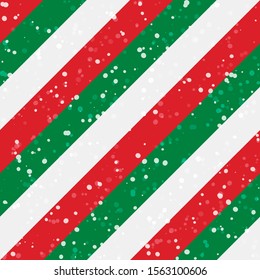 Christmas stripes seamless background. Diagonal red green peppermint with snow