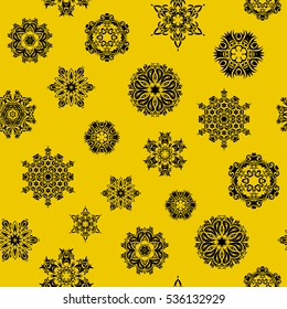 Christmas Stylized Snowflakes on a yellow Background. Seamless Repeating Pattern. Vector design.