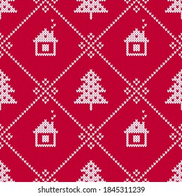 Christmas sweater diamond pattern with Christmas trees and winter cabins. Seamless winter pattern with little white houses on red background. Knitted background with winter holiday pattern.