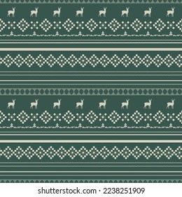Suéter navideño patrón sin fisuras sobre fondo de color verde