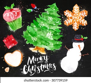 Christmas symbols with lettering and   cupcake, tree, gift, cookie, snowman, garland, snowflake drawing in vintage style on blackboard.